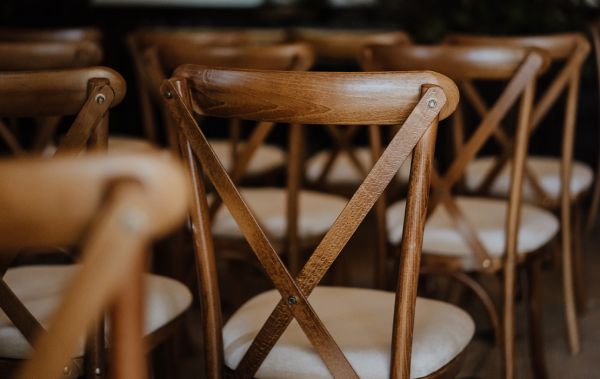 cross back chairs to accompnay rustic trestle tables from Crystal Hire